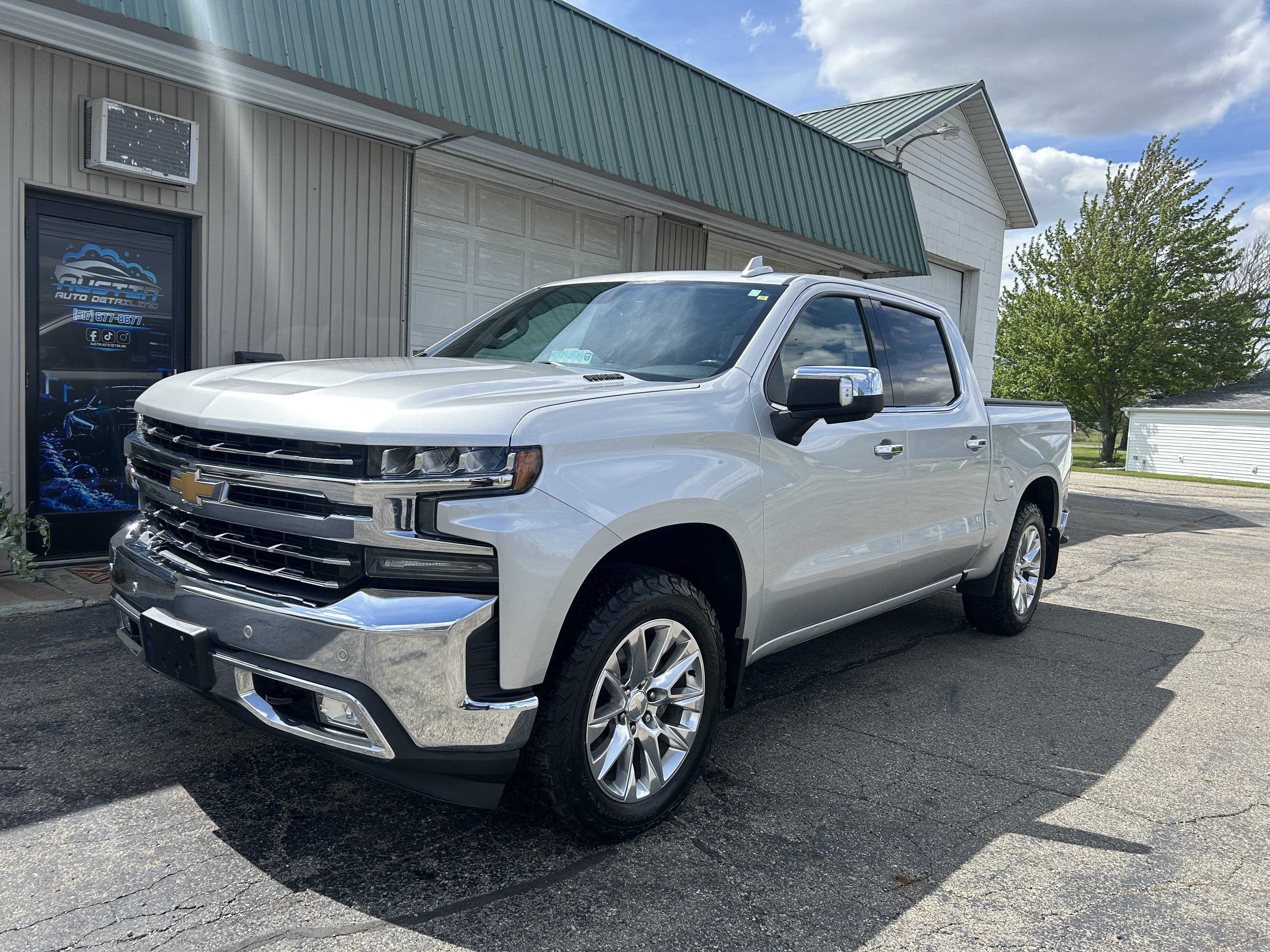 Austin Auto Detailing shop with white Silverado